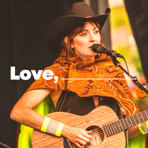 Woman playing a guitar and singing